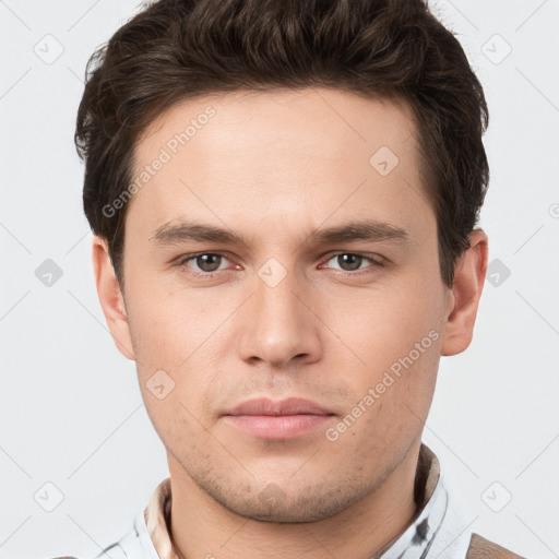 Neutral white young-adult male with short  brown hair and brown eyes