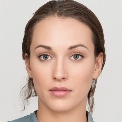 Neutral white young-adult female with medium  brown hair and grey eyes