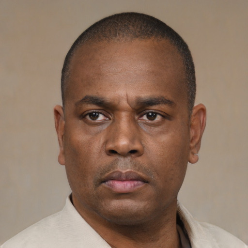 Neutral black adult male with short  black hair and brown eyes
