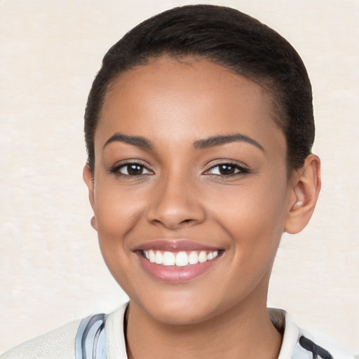 Joyful latino young-adult female with short  brown hair and brown eyes