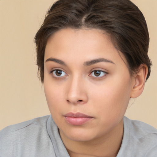 Neutral white young-adult female with medium  brown hair and brown eyes