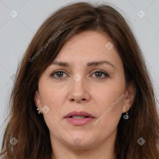 Joyful white adult female with long  brown hair and grey eyes