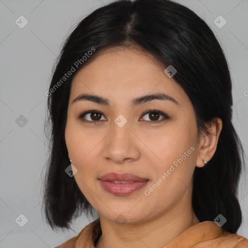 Joyful asian young-adult female with medium  black hair and brown eyes