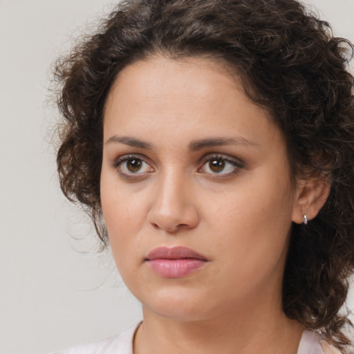 Neutral white young-adult female with medium  brown hair and brown eyes