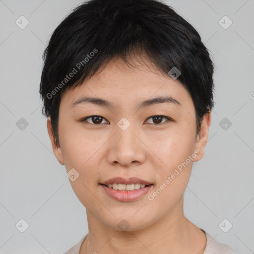 Joyful asian young-adult female with short  black hair and brown eyes