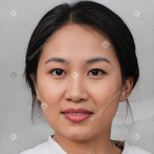 Joyful asian young-adult female with medium  brown hair and brown eyes