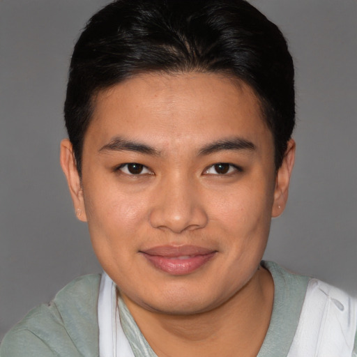 Joyful asian young-adult male with short  brown hair and brown eyes