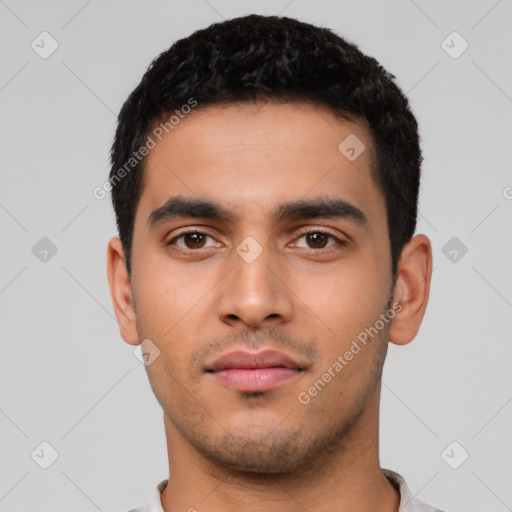 Neutral latino young-adult male with short  black hair and brown eyes