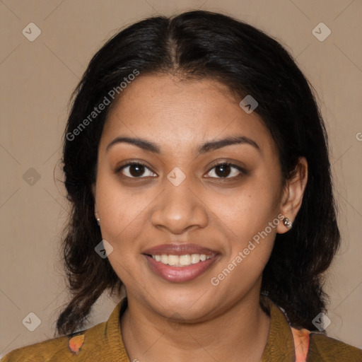 Joyful latino young-adult female with medium  brown hair and brown eyes