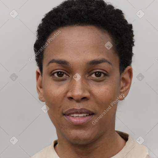 Joyful black young-adult female with short  black hair and brown eyes