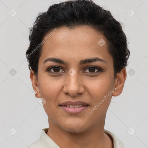 Joyful latino young-adult female with short  brown hair and brown eyes