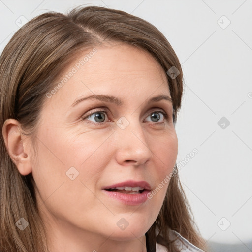 Joyful white young-adult female with long  brown hair and blue eyes