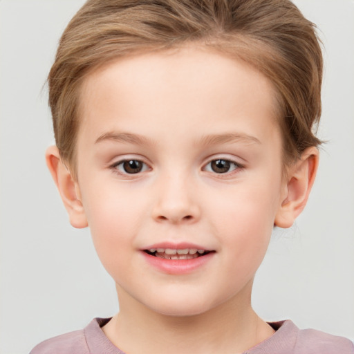 Joyful white child female with short  brown hair and brown eyes