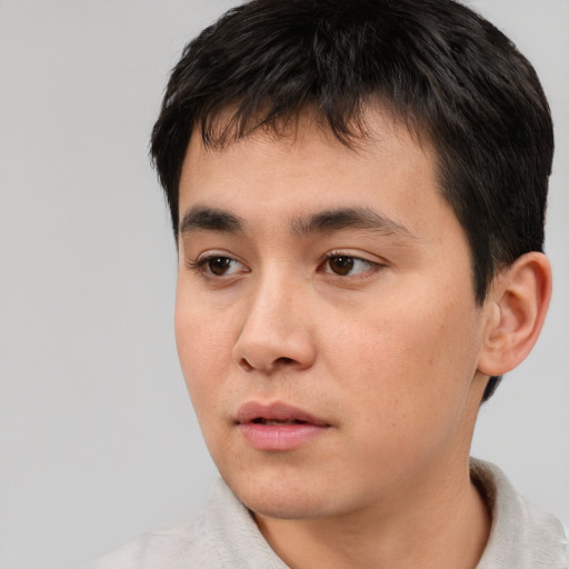 Neutral asian young-adult male with short  black hair and brown eyes
