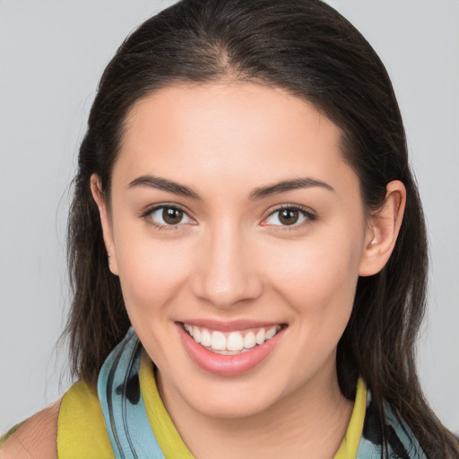 Joyful white young-adult female with medium  brown hair and brown eyes