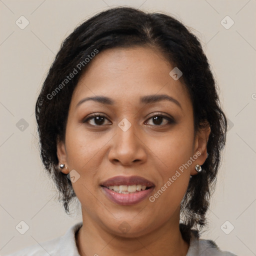 Joyful latino adult female with medium  brown hair and brown eyes