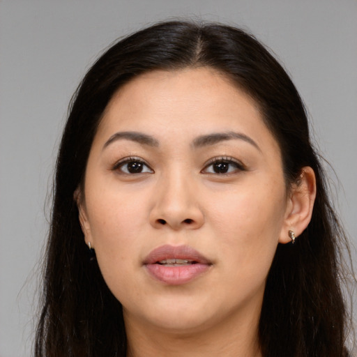 Joyful white young-adult female with long  brown hair and brown eyes