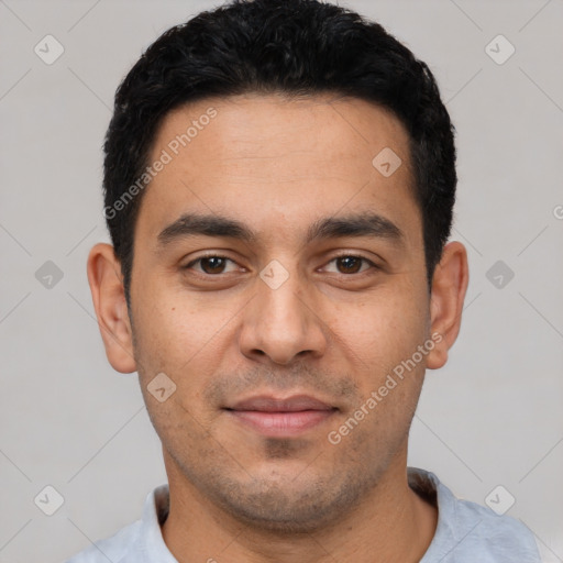 Joyful white young-adult male with short  black hair and brown eyes