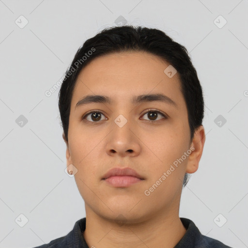 Neutral latino young-adult male with short  black hair and brown eyes