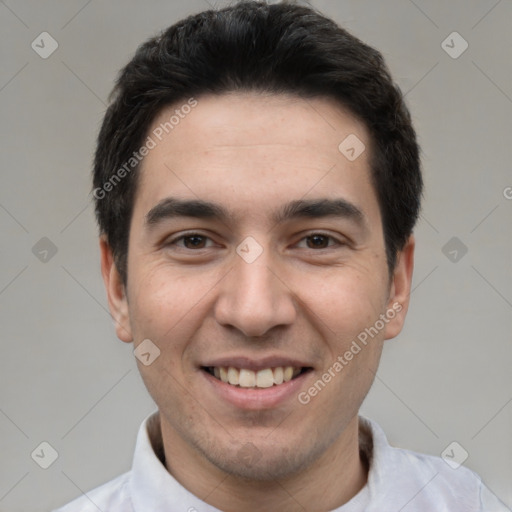 Joyful white young-adult male with short  black hair and brown eyes