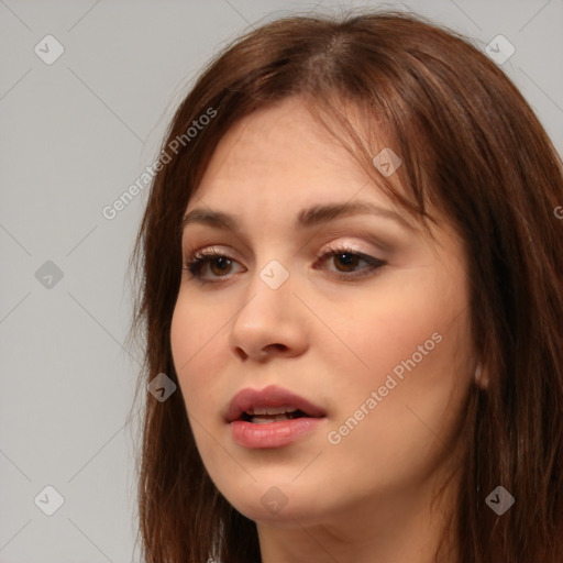 Neutral white young-adult female with long  brown hair and brown eyes