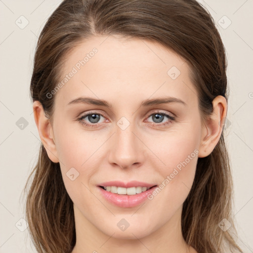 Joyful white young-adult female with medium  brown hair and green eyes