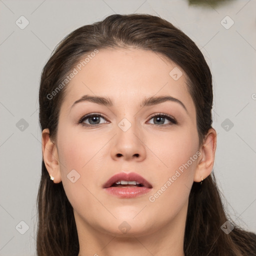 Neutral white young-adult female with long  brown hair and brown eyes