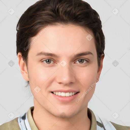 Joyful white young-adult female with short  brown hair and grey eyes