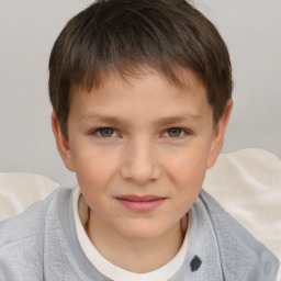 Joyful white child female with short  brown hair and brown eyes