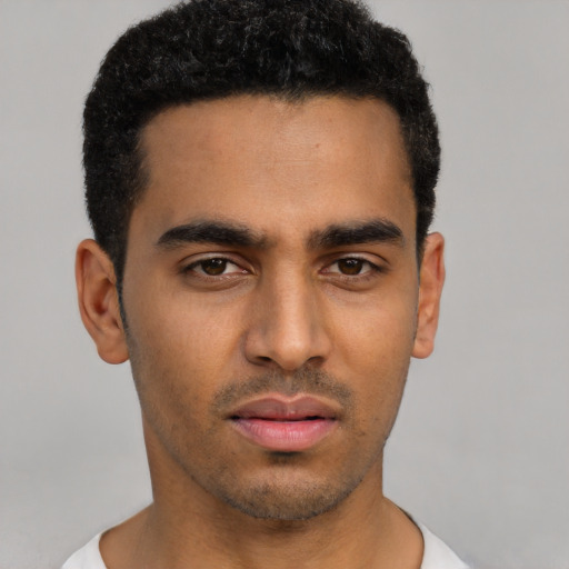 Neutral latino young-adult male with short  black hair and brown eyes