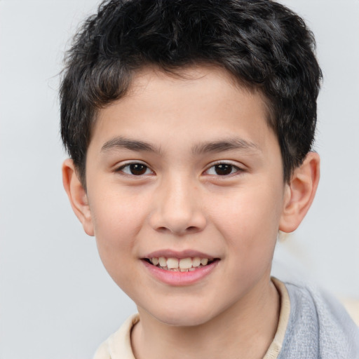 Joyful white child male with short  brown hair and brown eyes