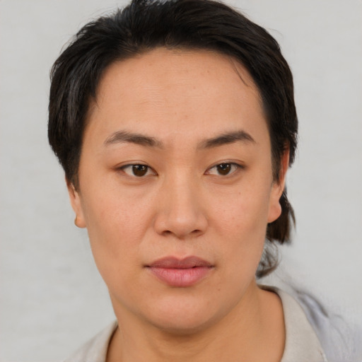 Neutral asian young-adult female with short  brown hair and brown eyes