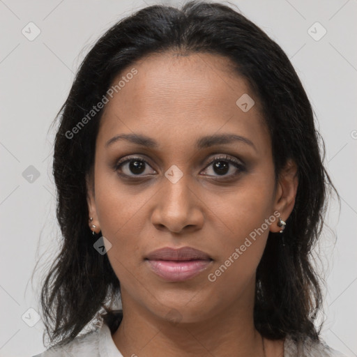 Joyful black young-adult female with medium  brown hair and brown eyes