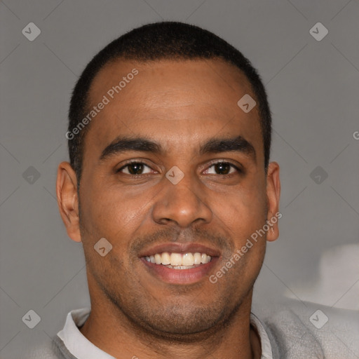 Joyful black young-adult male with short  brown hair and brown eyes