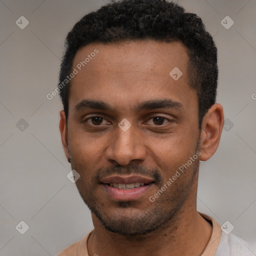 Joyful black young-adult male with short  black hair and brown eyes