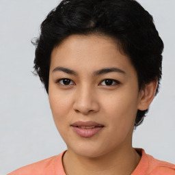 Joyful latino young-adult female with short  black hair and brown eyes