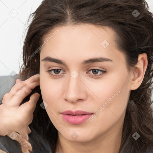 Neutral white young-adult female with long  brown hair and brown eyes