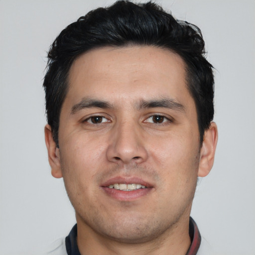 Joyful white young-adult male with short  black hair and brown eyes