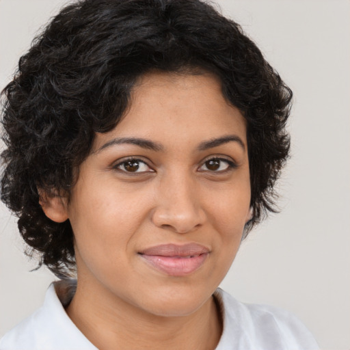 Joyful latino young-adult female with short  brown hair and brown eyes