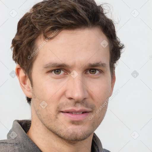 Joyful white adult male with short  brown hair and grey eyes