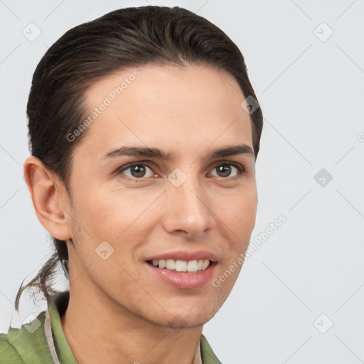 Joyful white young-adult female with short  brown hair and brown eyes