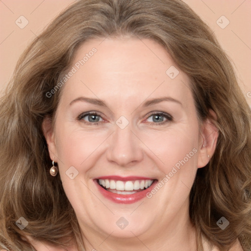 Joyful white adult female with long  brown hair and brown eyes