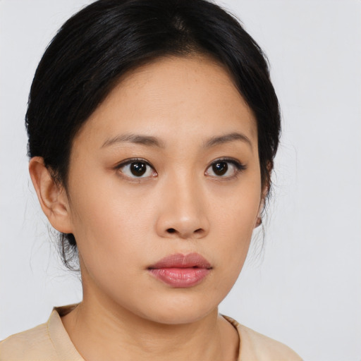 Neutral asian young-adult female with medium  black hair and brown eyes