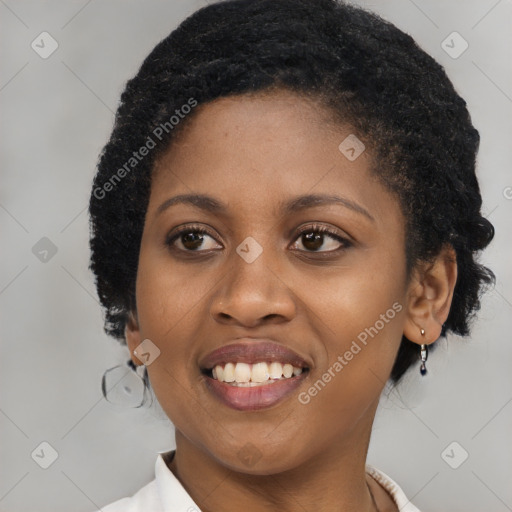 Joyful black young-adult female with short  black hair and brown eyes