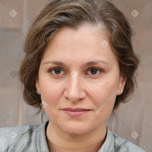 Joyful white adult female with medium  brown hair and grey eyes