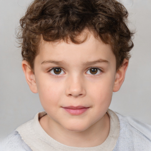 Joyful white child male with short  brown hair and brown eyes