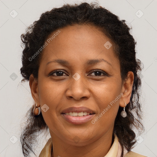 Joyful black adult female with medium  brown hair and brown eyes