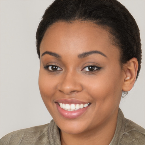 Joyful latino young-adult female with short  brown hair and brown eyes