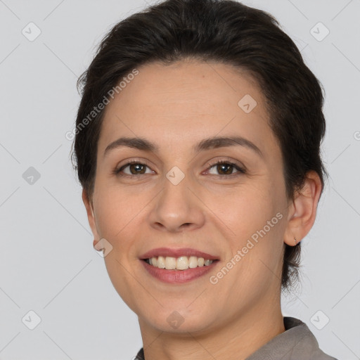 Joyful white adult female with short  brown hair and brown eyes