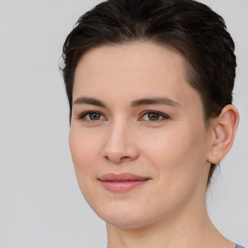 Joyful white young-adult female with medium  brown hair and brown eyes